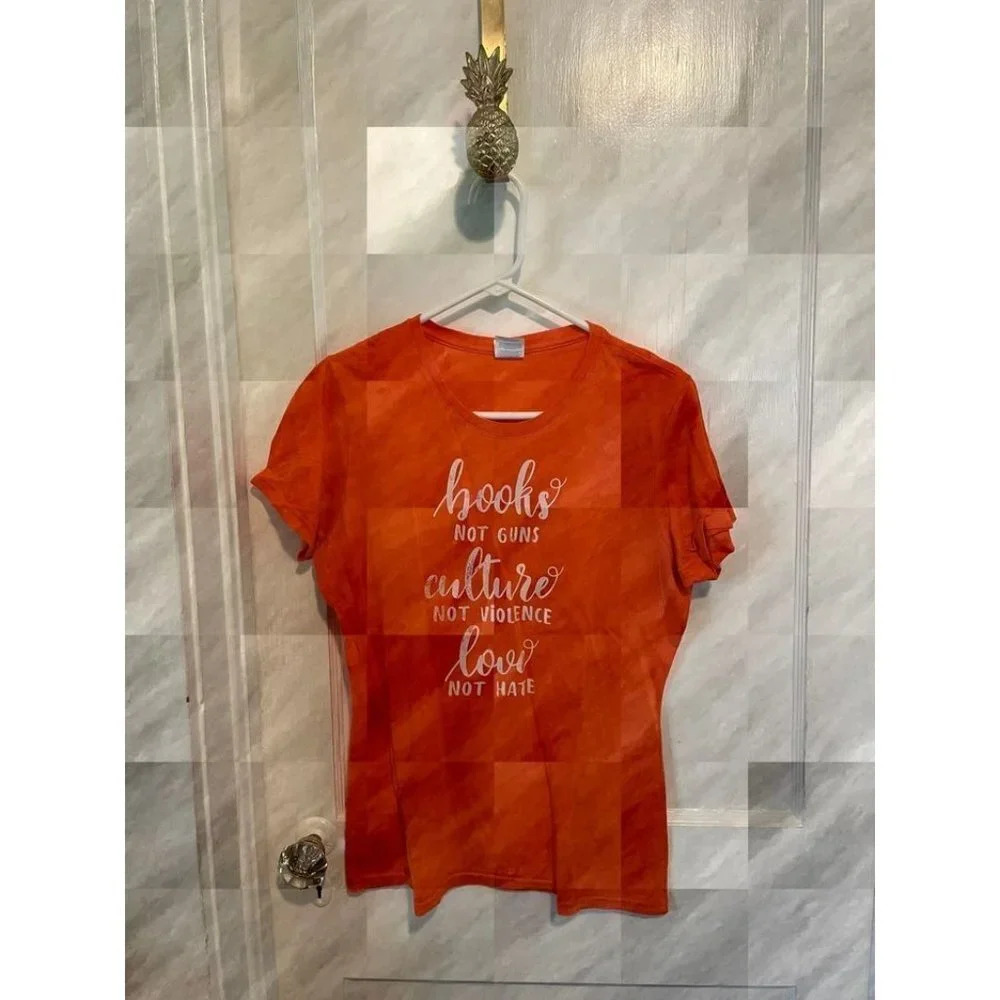 Women's size Medium Books not Guns, Culture not Violence, Love not Hate Orange T